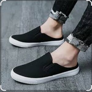 Sole Mate. Black and White Slip-On Loafers with Streamlined Design